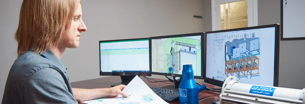 Engineer designing custom blow off systems using Air Knife and blower components